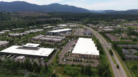 Cinematic aerial shot of the Snoqualmie Ridge commercial and shopping area, in King County Washington, near Seattle