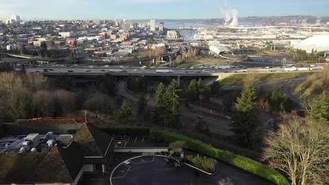 Aerial drone tracking shot of downtown Tacoma, harbor, dome, Commencement Bay, Puget Sound, ort of Tacoma, near Seattle in Western Washington, Pacific Northwest, economic center of Pierce County