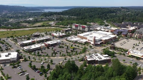 Cinematic aerial footage of the Issaquah Highlands, Grand Ridge Plaza, commercial and shopping area, in King County Washington, near Seattle and Bellevue in Western Washington