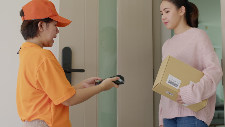 Asia young smile happy woman people receive parcel postal from e-commerce online shop store use tapping cashless wifi qr code nfc bill scan app smart pos device reader in city life home contactless. Royalty-Free Stock Footage #1073829320