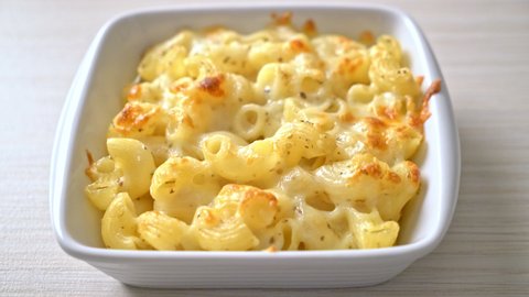 mac and cheese, macaroni pasta in cheesy sauce - American style