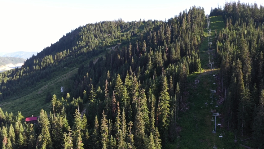 Cinematic drone shot of a ski resort slope during off season in Snoqualmie Pass Washington.