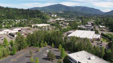 Cinematic aerial tracking shot of the Issaquah and Issaquah Highlands commercial and shopping area, in King County Washington, near Seattle and Bellevue in Western Washington