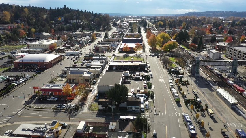 Aerial - drone footage of the commercial area near Kent Station, a shopping area downtown Kent in the Green River Valley near East Hill, Scenic Hill, Auburn, suburbs of Seattle, King County Washington
