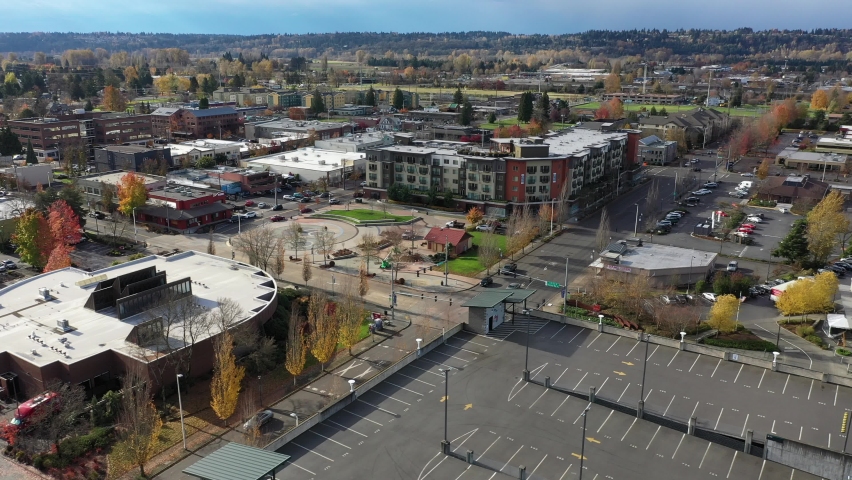 Aerial - drone footage of Kent Station, a shopping area downtown Kent in the Green River Valley near East Hill, Scenic Hill, Auburn, Renton, Federal Way, all suburbs of Seattle, King County Washington