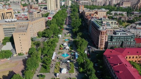  Aerial footage beautiful park and decorative fountains, near Republic square. Drone fly over public park with  Armenian khachkars, center of Yerevan,   capital of Armenia. Touristic place. 