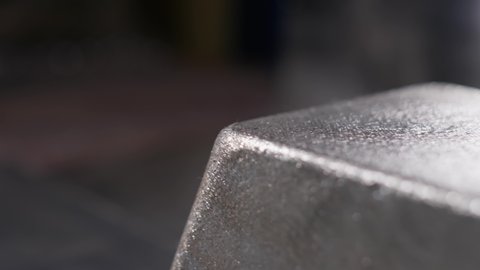 Close up at the edges of processed and polished silver bar at the factory