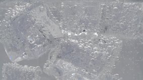 Soda and ice in the glass have bubbles. Close-up video. - Powered by Shutterstock - Get 15% off with code: PIKWIZARD15