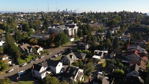 Flyover birdseye footage of Queen Anne, North Queen Anne, Seattle downtown, upscale, affluent neighborhoods uptown by Puget Sound, in Seattle, Washington