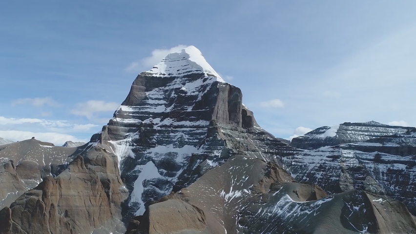 Aerial view of the southern side of Mount Kailash (height 6638 m), which is part of the Transhimalai in Tibet. It is considered a sacred site in four religions: Bon, Buddhism, Hinduism and Jainism. Royalty-Free Stock Footage #1073843054