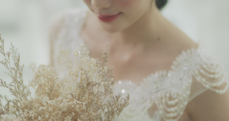Slow Motion Smiling Beautiful Asian Bride In Wedding Dress With Flowers Bouquet.