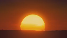 African sunset time lapse with big sun and cloudless sky Cinematic 4k footage. - Powered by Shutterstock - Get 15% off with code: PIKWIZARD15
