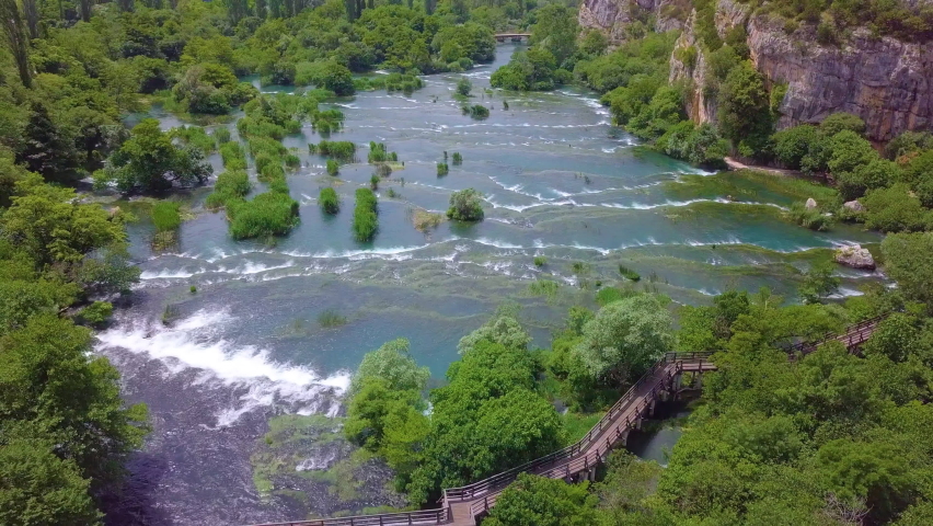 Beautiful waterfall, top sky view. Krka National Park, Croatia, Europe. Flight over the waterfall. Nice sunny day. 
Bird