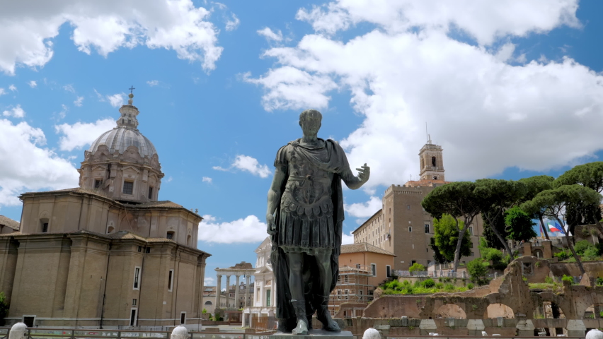 Bronze statue of emperor Julius Caesar along Via dei Fori Imperiali at the Roman Forum in Rome, Italy Royalty-Free Stock Footage #1073854508