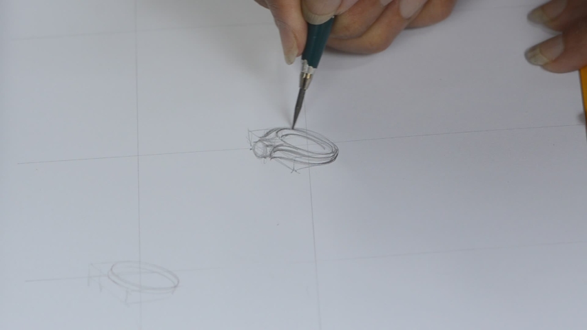The designer is sketching a picture of the jewelry ring. Royalty-Free Stock Footage #1073860391