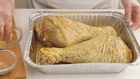 Roasted turkey recipe. Woman hands grate turkey meat with butter. Close up video, flat lay