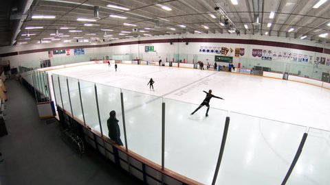 Denver, Colorado, USA-January 14, 2020 - Time lapse. Morning figure skating practice on the indoor ice skating rink.