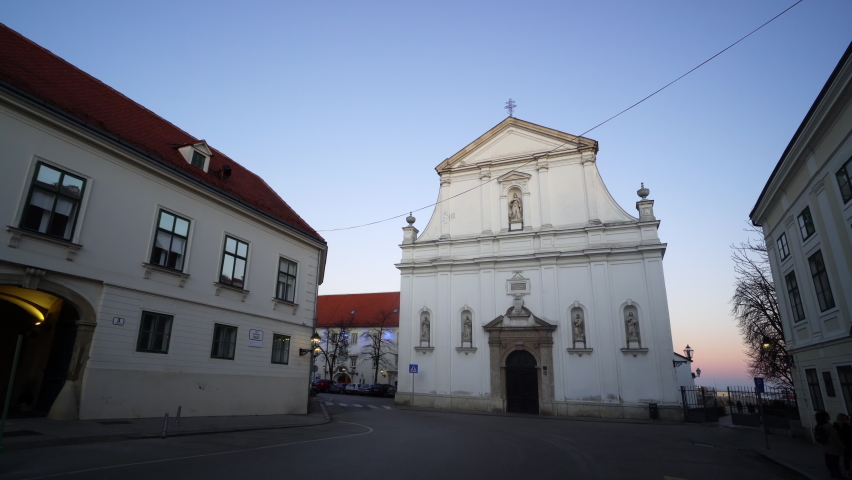 St. Catherine of Alexandria Church in Zagreb on a beautiful sunny autumn day with blue sky and local people