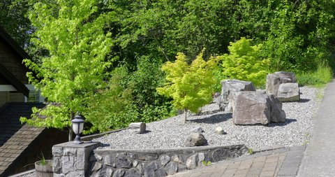 Establishing shot of nice outdoor landscape with rocks in Vancouver, Canada, North America. Overcast. Day time on June 2021. Still camera view. ProRes 422 HQ.