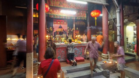 Bukit Mertajam, Penang, Malaysia - May 03 2019: Timelapse chinese people burn joss stick pray at temple