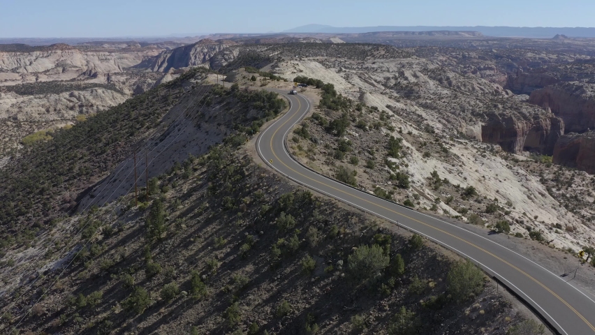 Aerial View of Dangerous Curvy Road Atop Mountain Ridge in High Desert of Utah