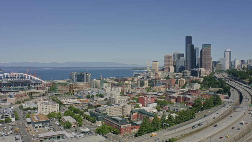 Seattle Washington Aerial v116 panning shot of highway, Elliot Bay, and high rise downtown - June 2020