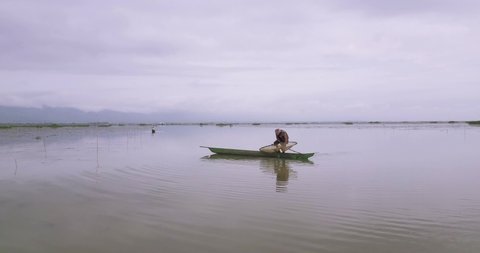Moirang , Manipur , India - 08 18 2018: Fisherman On His Wooden Boat Fishing At The Loktak Lake