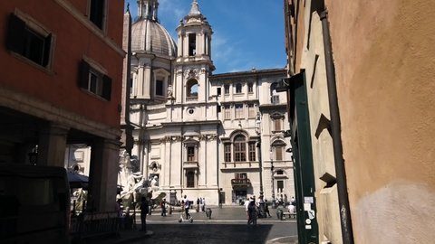 Europe, Italy  June 2021 - Hyper lapse of Piazza Navona in  Rome - tourists arrive to visit sightseeing after finish of lockdown due covid-19 Coronavirus - Zeus statue and obelisk