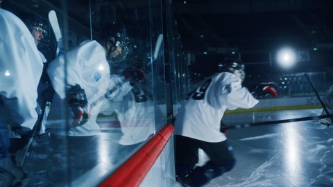 Ice Hockey: Professional Players go on Ice, ready for the Championship Match to Start. Blue Cinematic Slow Motion Dolly Wide Shot