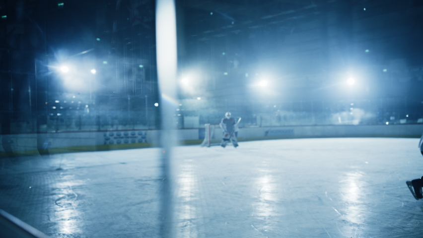 Ice Hockey Rink Arena: Professional Forward Player Attacks, Boarding Defender Aggressively, Taking away the Puck. Competitive Intense Game with Amazing Skills, Speed, Energy, Power. Slow Motion Royalty-Free Stock Footage #1073888522