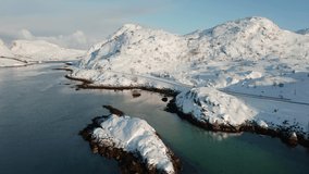 4k drone forward video (Ultra High Definition) of Andopen fjord. Incredible winter seascape of Norwegian sea. Wonderful morning scene of Lofoten Islands archipelago, Norway.