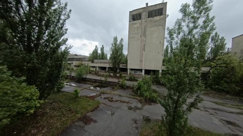 FPV drone view. Flight over central square of abandoned Pripyat city in the rain. Pripyat - 19 may 2021.