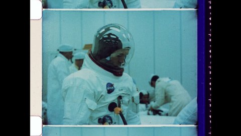 July 20th 1969, Cape Canaveral, FL. Astronaut Michael Collins dressed in Spacesuit before the Launch of Apollo 11 Rocket. 4K Overscan of Vintage Archival 16mm Film Print