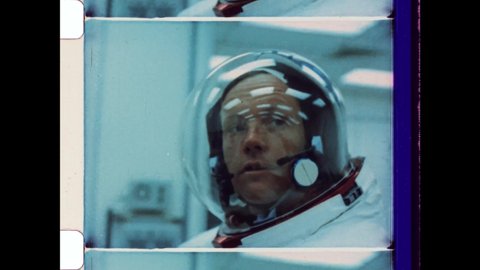July 20th 1969, Cape Canaveral, FL. Astronaut Neil Armstrong getting dressed in Spacesuit before the Launch of Apollo 11 Rocket. 4K Overscan of Vintage Archival 16mm Film Print