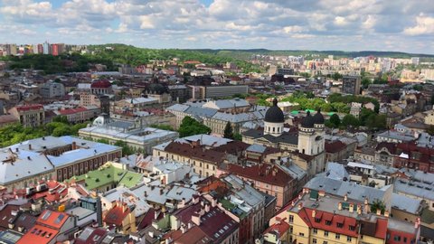 Old city center in Europe. Roofs. TV tower. Old lock. historical Buildings. Old city. Domes of the temple. Architecture. A cinematic overview of the city of Lviv from the air. Lviv Ukraine, July 2021: