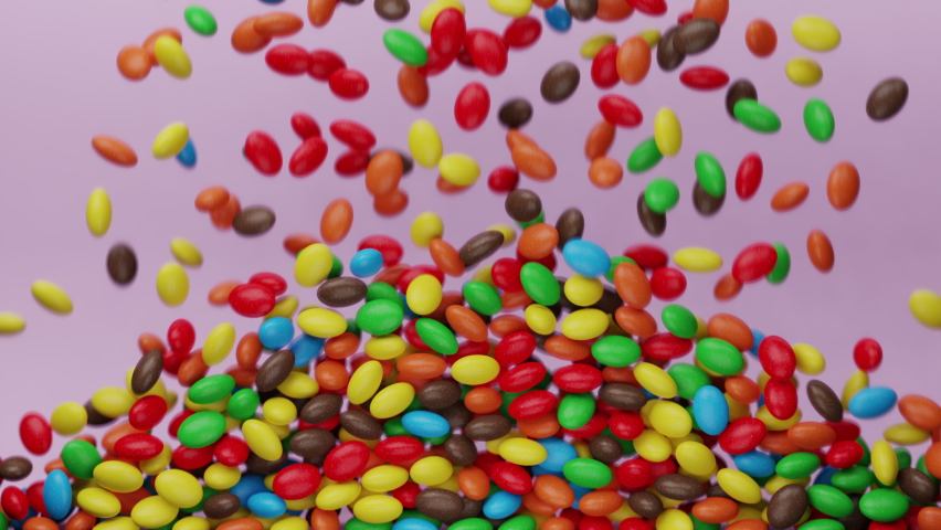 Bright and colorful candy beans or peanuts are falling down. Multicoloured tasty sugar sweets. Chocolate candies filling all the area. Close up. Red, green, yellow colors. Holiday mood. 3D Render 4K | Shutterstock HD Video #1073929277