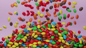 Bright and colorful candy beans or peanuts are falling down. Multicoloured tasty sugar sweets. Chocolate candies filling all the area. Close up. Red, green, yellow colors. Holiday mood. 3D Render 4K - Powered by Shutterstock - Get 15% off with code: PIKWIZARD15