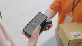 Asia young smile happy woman people receive parcel postal from e-commerce online shop store use tapping cashless wifi qr code nfc bill scan app smart pos device reader in city life home contactless. - Powered by Shutterstock - Get 15% off with code: PIKWIZARD15