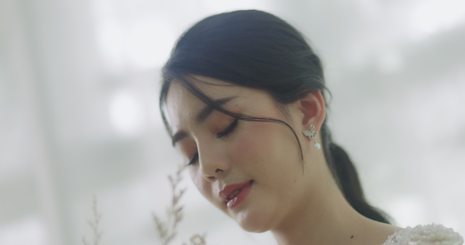 Slow Motion Smiling Beautiful Asian Bride In Wedding Dress With Flowers Bouquet.