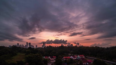 Dramatic time lapse of the Johor Bahru skyline - Incredible sunrise with fasting clouds at the day begins - Malaysia 