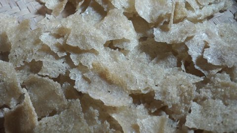 Raw kerupuk gendar (puli, kerupuk beras, Lempeng Puli) with a natural background. Kerupuk gendar made of used rice (rice cracker)