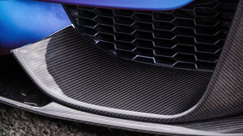 KYIV-15 MAY,2021: Carbon front spoiler on BMW M3 F80 Sport Car wrapped in blue vinyl and filmed in close up 4K video clip on Drift And Cars Show