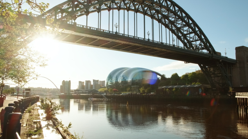 Morning walk revealing the Tyne Bridge spanning the River Tyne between Newcastle and Gateshead, in Tyne and Wear, England, UK Royalty-Free Stock Footage #1073943503