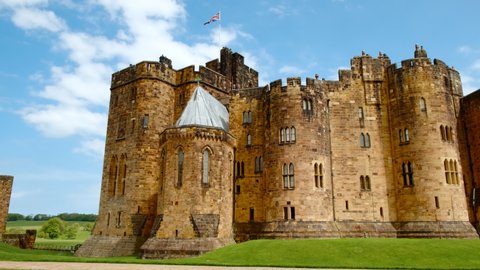 ALNWICK, circa 2021 - Wide view of Alnwick Castle, a castle and country house in Alnwick in Northumberland, England, UK, built following the Norman conquest