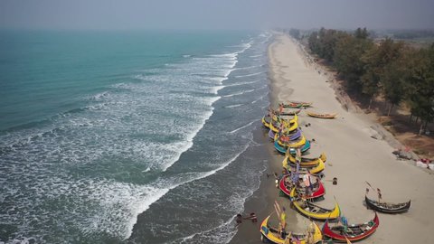 Aerial view of traditional fishing boats along the shoreline on the beach on St. Martin's Island, Teknaf, Chittagong, Bangladesh.