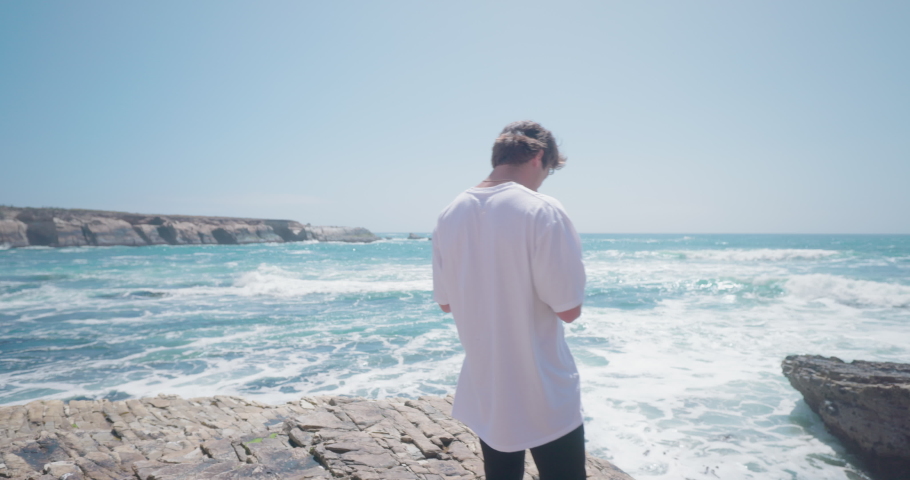 Young adult flies drone from the rocks of the California coast.