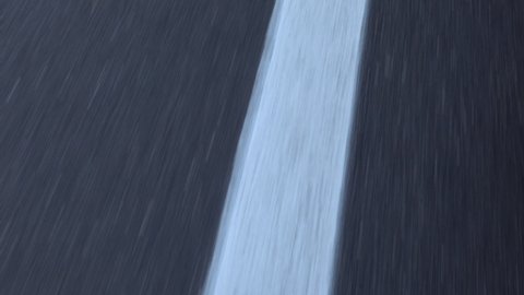 Close up of white dotted line on an asphalt road. Fast speed.