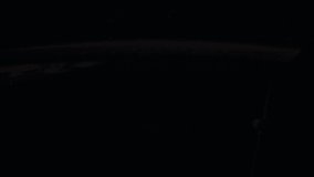 Time-lapse Video of Earth seen from the Space Station with dark sky and city lights at night over Romania to North Atlantic Ocean, Time Lapse 4K. Images courtesy of NASA. Prores.