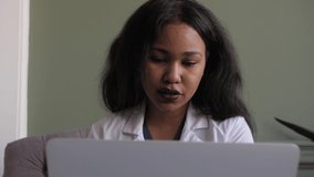 Black female doctor. webiran of doctors. Telemedicine the use of computer 