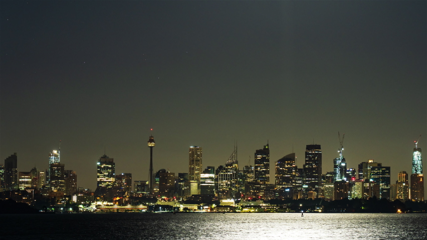 Timelapse of Sydney City Skyline with setting Full Moon 